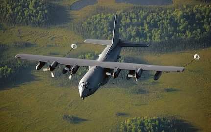 An Alaska Air National Guard HC-130 "King," from the 211th Rescue Squadron, flies on a training mission over Alaska, during the summer of 2011, to conduct air-to-air refueling with two HH-60 Pave Hawk helicopters from the 210th Rescue Squadron.