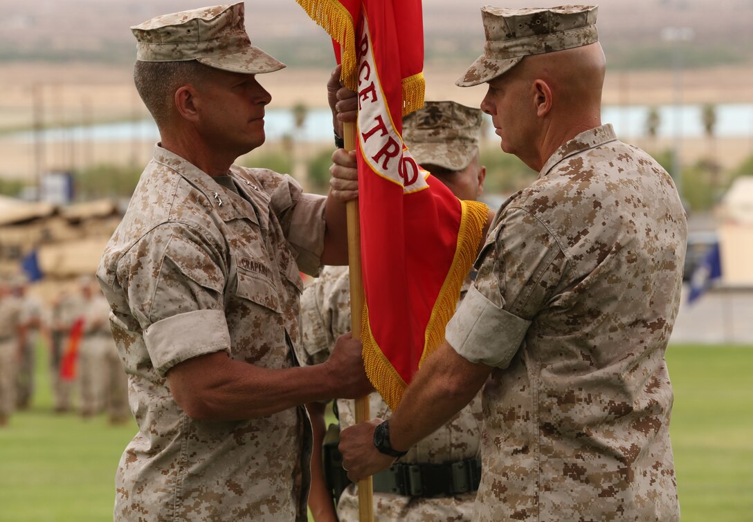 Maj. Gen. David H. Berger, former Combat Center Commanding General, formally relinquishes his command to Maj. Gen. Lewis A. Craparotta, Combat Center Commanding General, during a change of command ceremony at Lance Cpl. Torrey L. Gray Field, July 10, 2014. Berger has been nominated by President Obama for appointment to lieutenant general and command of I Marine Expeditionary Force, based in Marine Corps Base Camp Pendleton, Calif.