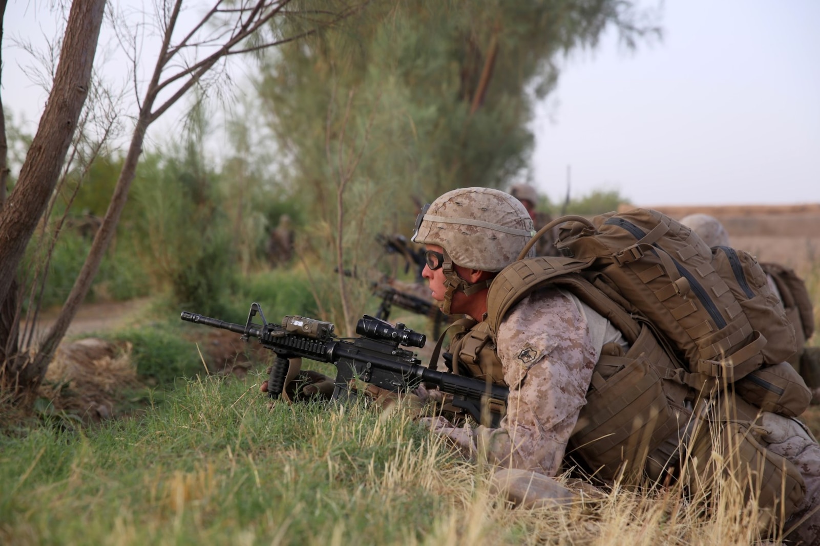 Petty Officer 3rd Class Heston Johnson, corpsman, Bravo Company, 1st Battalion, 7th Marine Regiment, provides security during a mission in Helmand province, Afghanistan, July 4, 2014. Johnson, a native of Athena, Ore., and the company operated in Gereshk for three days and were involved in numerous kinetic engagements with Taliban insurgents.
(U.S. Marine Corps photo by Cpl. Joseph Scanlan / released)