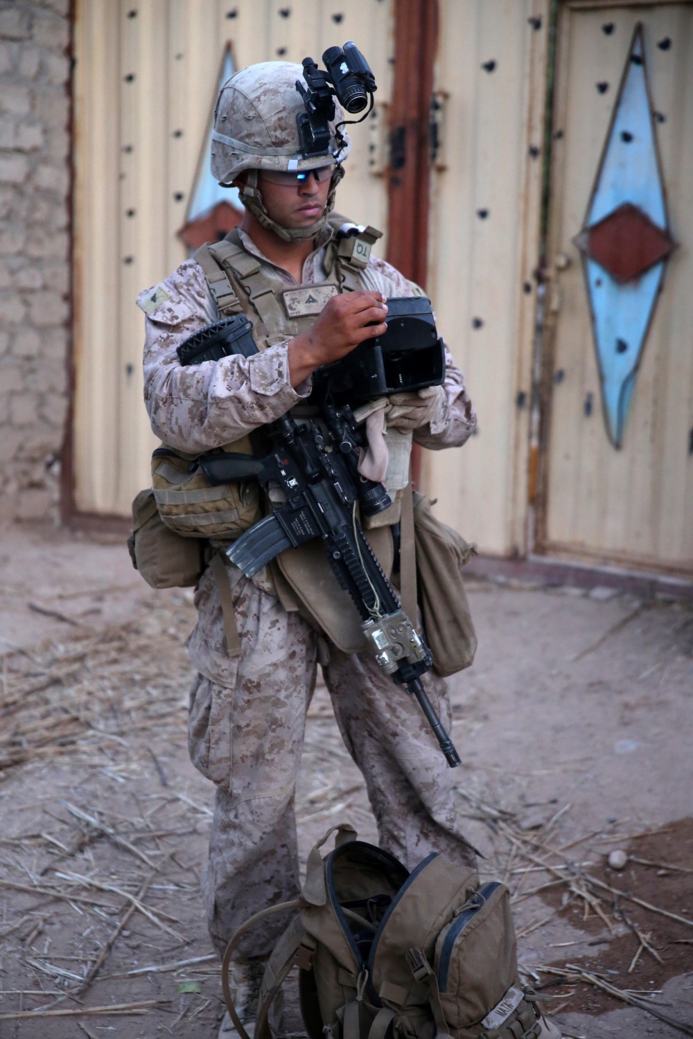 Lance Cpl. Branden Mata, rifleman, Bravo Company, 1st Battalion, 7th Marine Regiment, utilizes a Biometrics Enrollment and Screening Device during a mission in Helmand province, Afghanistan, July 5, 2014. Mata, a native of Panorama City, Calif., and the company operated in Gereshk for three days and were involved in numerous kinetic engagements with Taliban insurgents.
(U.S. Marine Corps photo by Cpl. Joseph Scanlan / released)