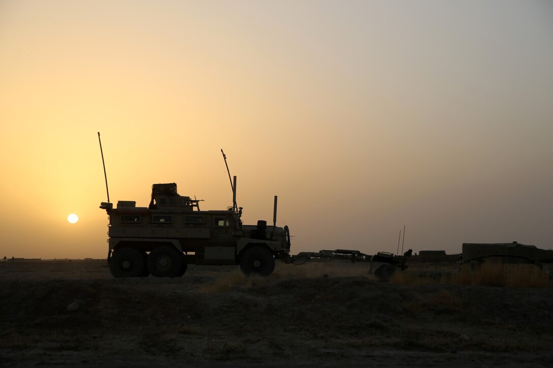 Marines with Bravo Company, 1st Battalion, 7th Marine Regiment, provide security from a Mine-Resistant Ambush-Protected vehicle during a mission in Helmand province, Afghanistan, July 5, 2014. The company operated in Gereshk for three days and was involved in numerous kinetic engagements with Taliban insurgents.
(U.S. Marine Corps photo by Cpl. Joseph Scanlan / released)