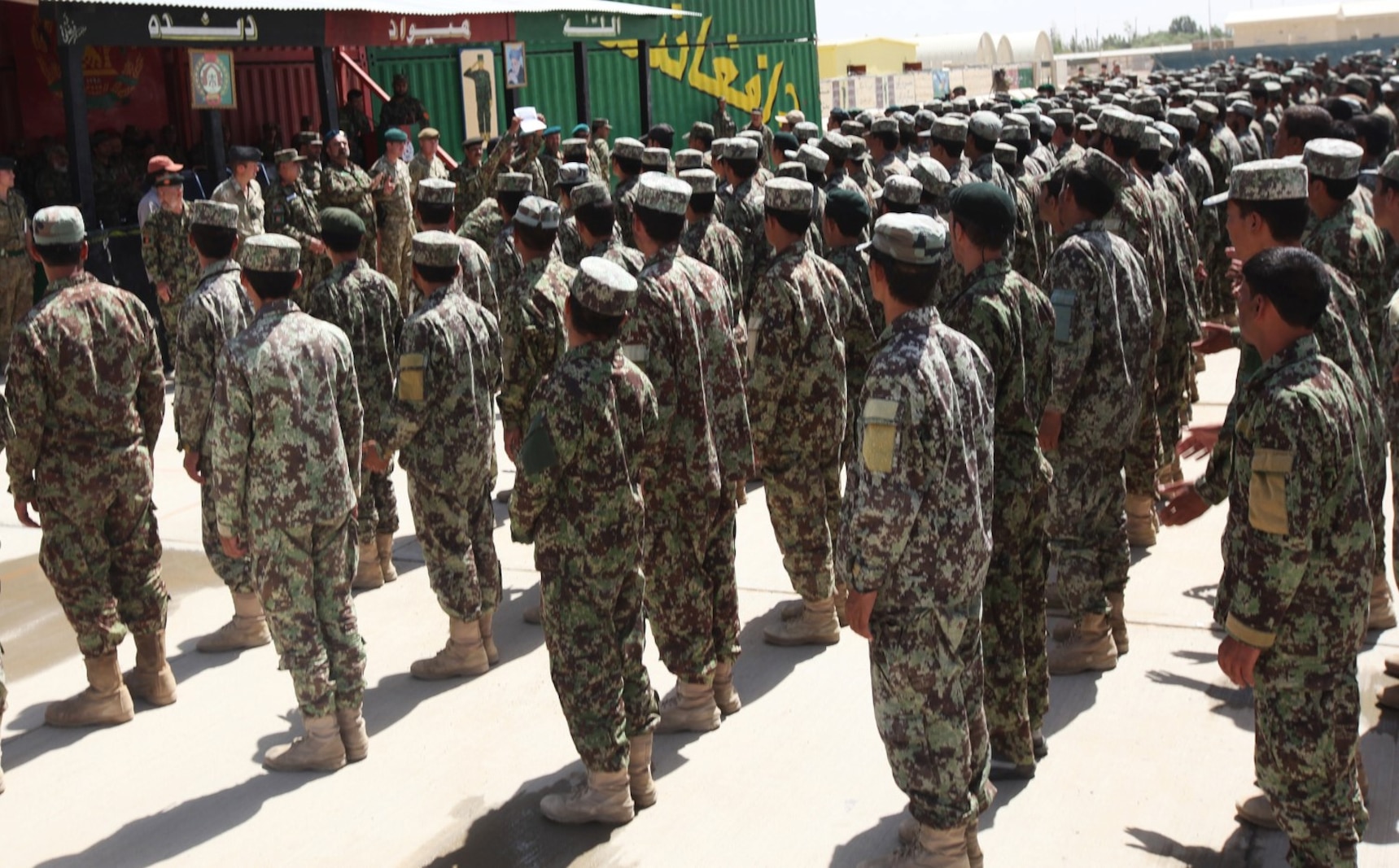 Afghan National Army soldiers with the 215th Corps stand in formation during their graduation ceremony aboard Camp Shorabak, Afghanistan, July 10, 2014. More than 650 soldiers graduated a completely Afghan-led, six-week combat training course, which consisted of 29 courses varying from hands-on weapons training to rifleman tactics. (U.S. Marine Corps photo by Cpl. Cody Haas/ Released)