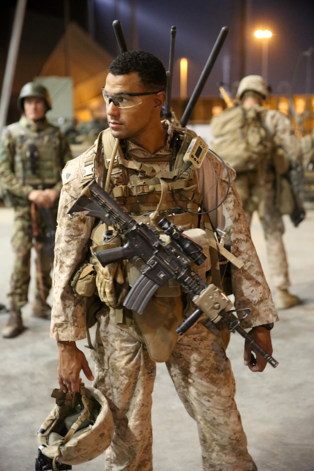 Corporal Anthony Davis, fire team leader, Bravo Company, 1st Battalion, 7th Marine Regiment, dons his personal protective gear before a mission in Helmand province, Afghanistan, July 4, 2014. Davis, a native of Poulsbo, Wash., and the company operated in Gereshk for three days and were involved in numerous kinetic engagements with Taliban insurgents.
(U.S. Marine Corps photo by Cpl. Joseph Scanlan / released)
