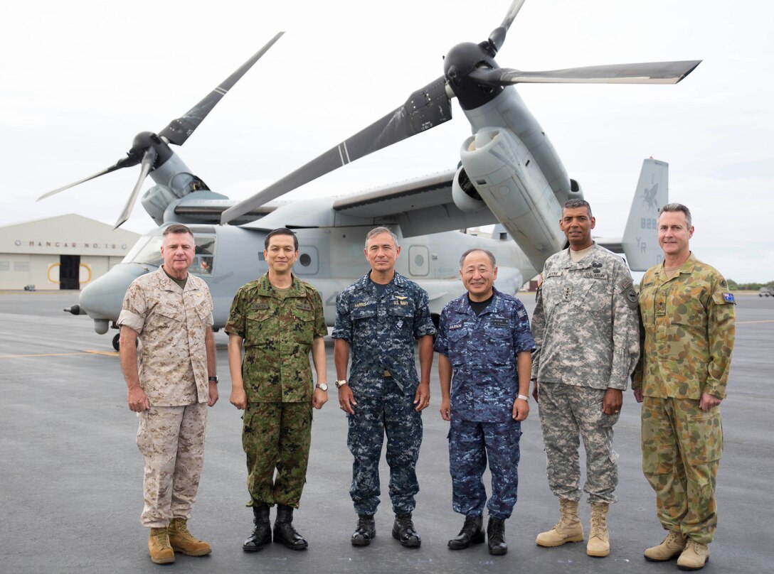 Senior military commanders from Australia, Japan and the United States pause for a quick orientation before boarding a U.S. Marine Corps MV-22 Osprey that will transport them to the USS Peleliu (LHA-5) amphibious assault ship for a discussion on Maritime Power Projection. The senior officers met to exchange professional views, discuss ways to improve military-to-military relationships and increase interoperability, and to extend their professional and personal bonds of friendship. Shown in the photo are (from left to right): Lt. Gen. Terry G. Robling, Commander, U.S. Marine Corps Forces, Pacific; Gen. Kiyofumi Iwata, Chief of Staff, Japan Ground Self-Defense Force; Adm. Harry B. Harris, Jr., Commander, U.S. Pacific Fleet; Adm. Katsutoshi Kawano, Chief of Staff, Japan Maritime Self-Defense Force; Gen. Vincent K. Brooks, Commander, U.S. Army Pacific; and Major General Peter Warwick "Gus" Gilmore, Deputy Chief of Army, Royal Australian Army.