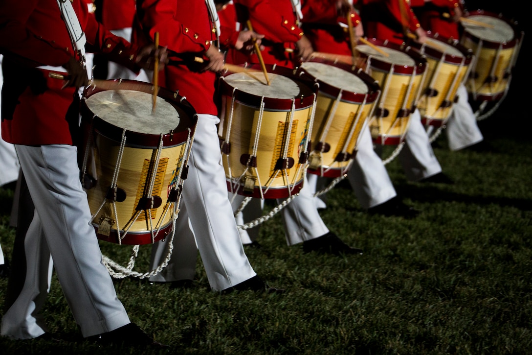 The U.S. Marine Drum & Bugle Corps performs during a Friday Evening Parade at Marine Barracks Washington, D.C., July 11, 2014.