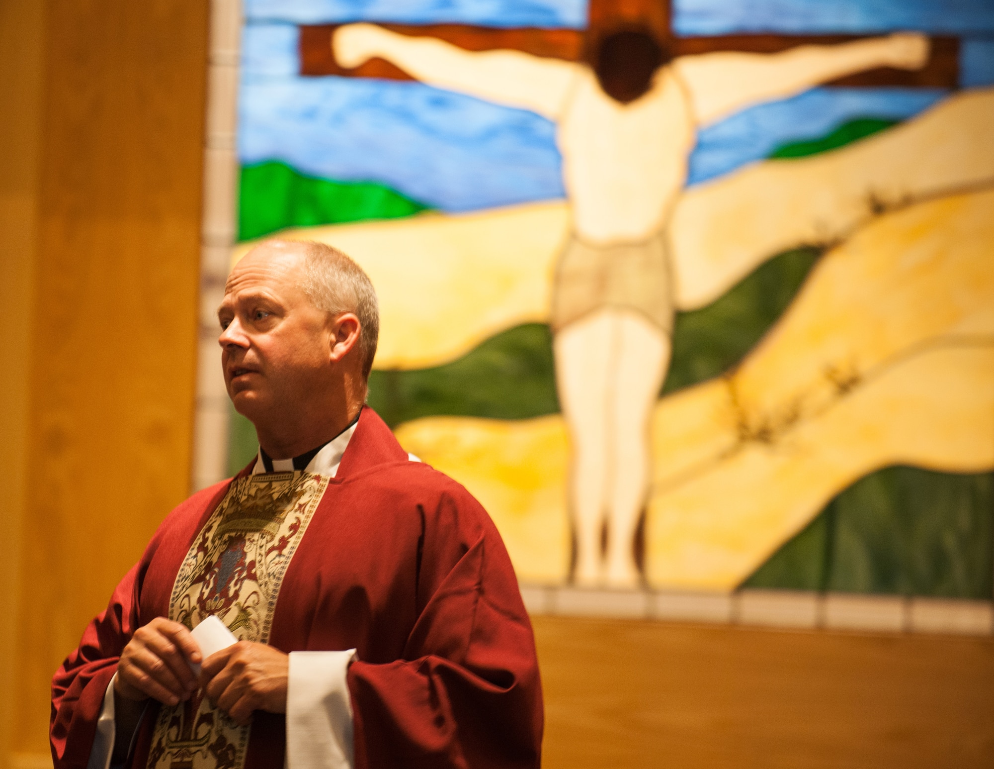 U.S. Air Force Maj. Chad Zielinski, 354th Fighter Wing Catholic chaplain, preaches during Sunday Mass at Fort Wainwright, Alaska, June 29, 2014. Chaplain Zielinski was filling in as the Fort Wainwright Catholic Chaplain during a manning shortfall.  (U.S. Air Force photo by Tech. Sgt. Joseph Swafford/Released)