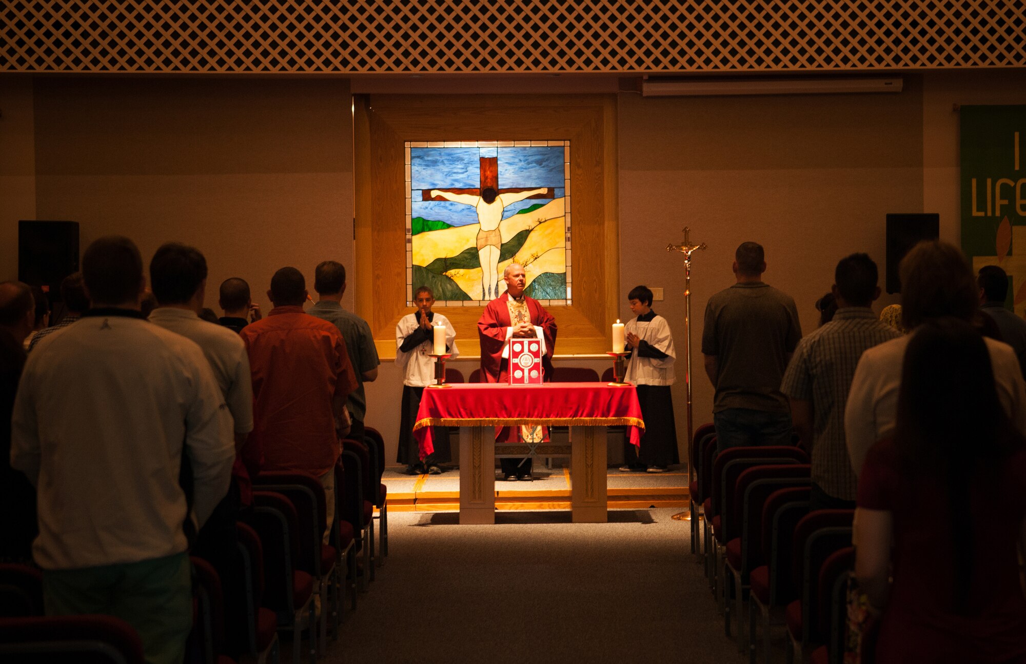 U.S. Air Force Maj. Chad Zielinski, 354th Fighter Wing Catholic chaplain, preaches during Sunday Mass at Fort Wainwright, Alaska, June 29, 2014. Chaplain Zielinski was filling in as the Fort Wainwright Catholic Chaplain during a manning shortfall.  (U.S. Air Force photo by Tech. Sgt. Joseph Swafford/Released)