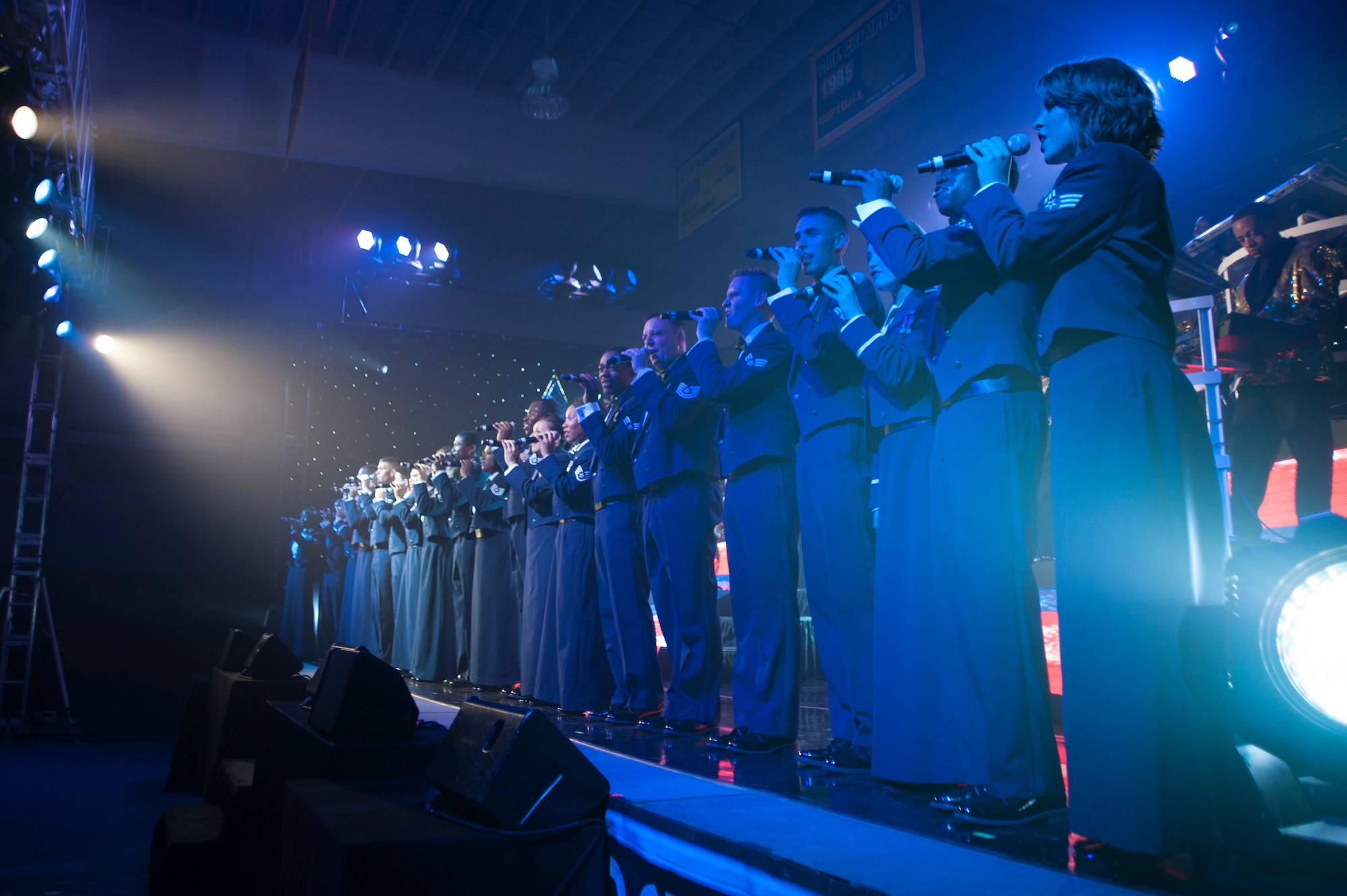 Members of Tops In Blue line up and perform at the front of the stage for a finale July 11, 2014, Cabrillo High School, Lompoc, Calif. Celebrating 60 years of tradition, Tops In Blue performed for Vandenberg personnel, families and members of the local community. (U.S. Air Force photo by Senior Airman Armando Aparicio/Released)