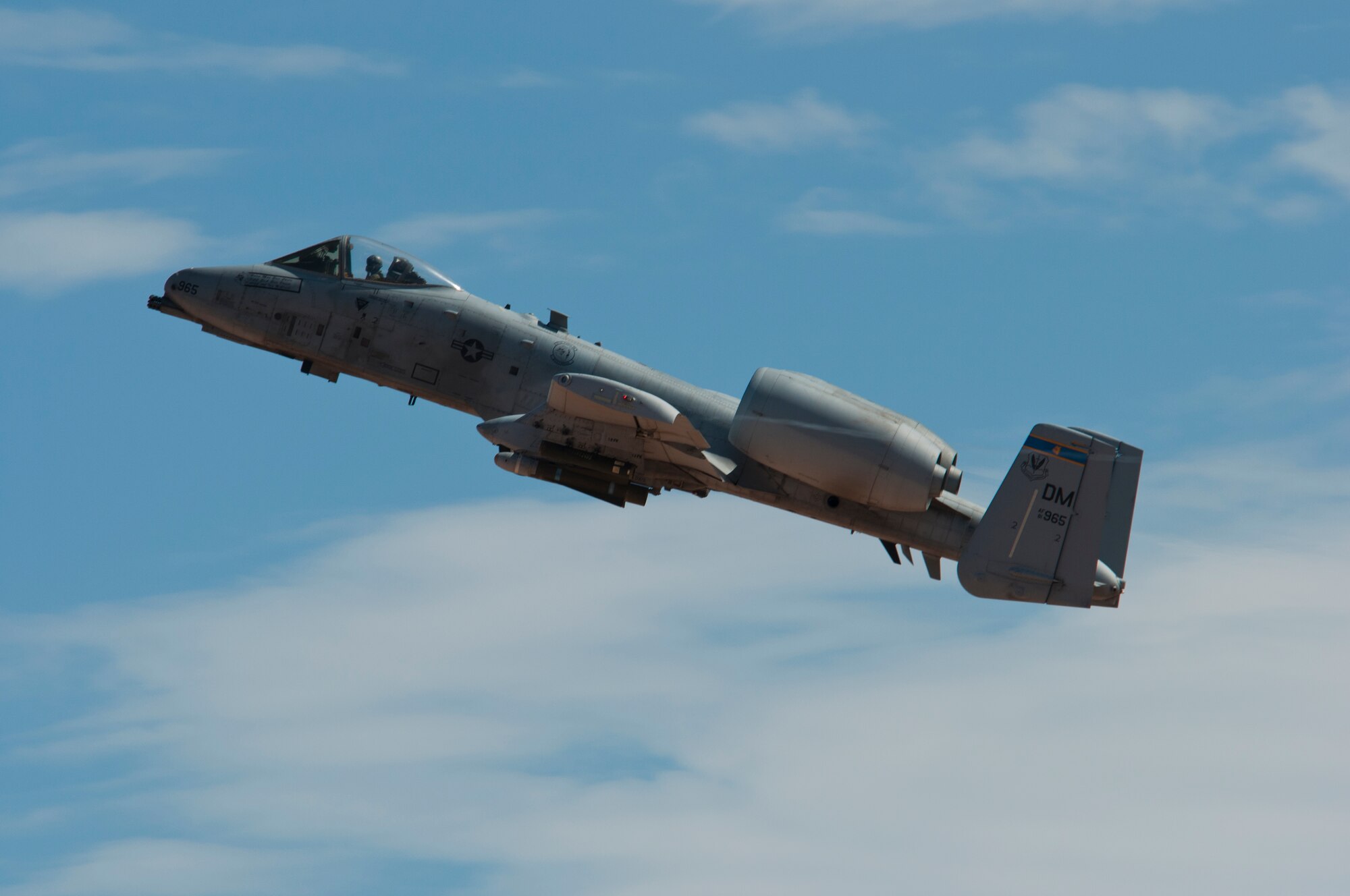 U.S. Air Force A-10 Thunderbolt II from Davis-Monthan Air Force Base flies during the 2014 Hawgsmoke Competition at Barry M. Goldwater Range Two in Tucson, Ariz., July 10, 2014. Hawgsmoke is a biennial worldwide A-10 bombing, missile, and tactical gunnery competition. Four-ship teams of airplanes and pilots from A-10 units around the world compete for the honor of being the best in ground attack and target destruction. (U.S. Air Force photo by Capt. Susan Harrington/Released)