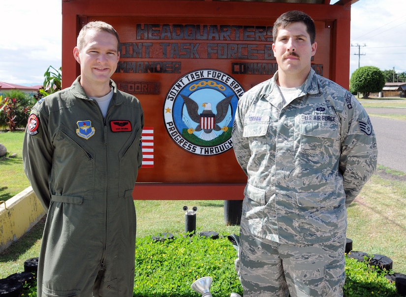 U.S. Air Force Capt. Daniel Gruben (left) and U.S. Air Force Staff Sgt. Zachary Yoakam provided life-saving first aid to a Honduran boy injured when a vehicle struck him in the Arturo Quezada residential area of Tegucigalpa, Honduras, July 9, 2014.  Gruben and Yoakam were returning to Soto Cano Air Base after a day of meetings in Tegucigalpa when they witnessed a truck striking the boy, Jose, at highway speed.  (Photo by U. S. Air National Guard Capt. Steven Stubbs)