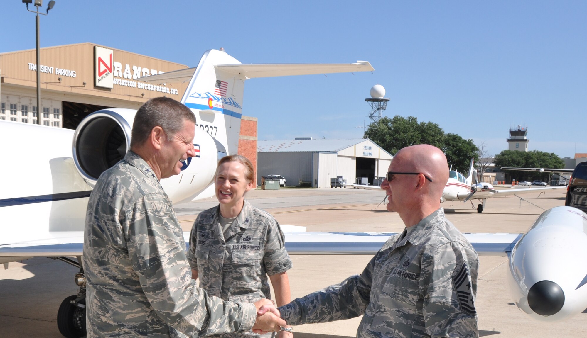 SAN ANGELO, Texas – Col. Kimberlee P. Joos, 17th Training Wing Commander, and Chief Master Sgt. Thomas F. Good, 17th TRW command chief master sergeant, greet Gen. Robin Rand, commander of Air Education and Training Command, at the San Angelo Regional Airport, here, July 10. Gen. Rand visited Goodfellow for two days, touring the base facilities and meeting with Airmen and officers. (U.S. Air Force photo/ Senior Airman Joshua Edwards)
