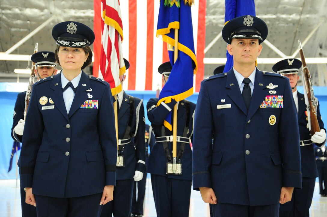 Maj. Gen. Sharon K. G. Dunbar, Air Force District of Washington commander, and Col. Bill Knight pose for Knight’s receiving of the Legion of Merit at the 11th Wing change of command ceremony at Joint Base Andrews, Md., July 14, 2014. This ceremony transfers command from Knight to Col. Bradley Hoagland. (U.S. Air Force photo/Airman 1st Class Joshua R. M. Dewberry)