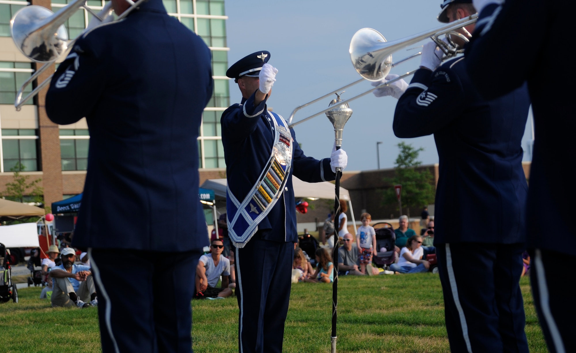 Senior Master Sgt. Thomas Scott Hinds conducts the Ceremonial Brass as they play for spectators at the Joint Base Andrews Heritage Park Concert, July 12, 2014. The concert series was designed to show appreciation to the local community for their support and showcase JBA's dedicated Airmen. This was the second of three concerts scheduled for this summer. (U.S. Air Force photo/Tech. Sgt. Brian Ferguson)
