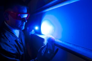A U.S. Army Criminal Investigation Command Special Agent uses an alternate light source while processing a crime scene. CID recently launched a new centralized recruiting program, part of which features an online application process aimed at recruiting qualified Soldiers to become CID Special Agents. (U.S. Army photo by Jeffrey Castro)