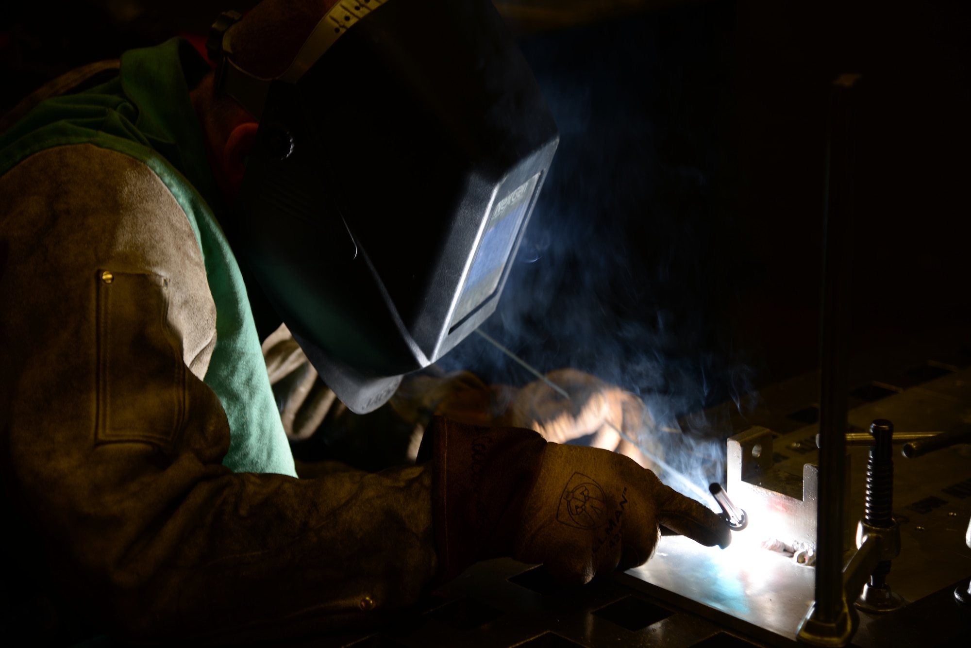 Senior Airman Deryc Coulson, 23d Equipment Maintenance Squadron fabrications flight aircraft metals technology journeyman, uses aluminum to seal the maintenance stand for a .50-caliber machine gun July 11, 2014, at Moody Air Force Base, Ga. The fabrications flight creates, welds and repairs materials for aircrafts from the A-10C Thunderbolt IIs to HH-60G Pave Hawks. (U.S. Air Force photo by Staff Sgt. Eric Summers Jr./Released)