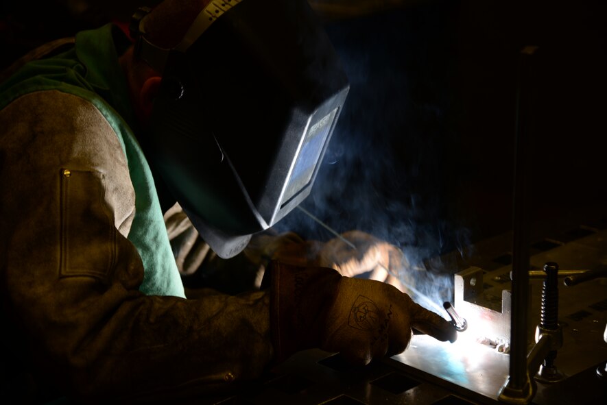 Senior Airman Deryc Coulson, 23d Equipment Maintenance Squadron fabrications flight aircraft metals technology journeyman, uses aluminum to seal the maintenance stand for a .50-caliber machine gun July 11, 2014, at Moody Air Force Base, Ga. The fabrications flight creates, welds and repairs materials for aircrafts from the A-10C Thunderbolt IIs to HH-60G Pave Hawks. (U.S. Air Force photo by Staff Sgt. Eric Summers Jr./Released)
