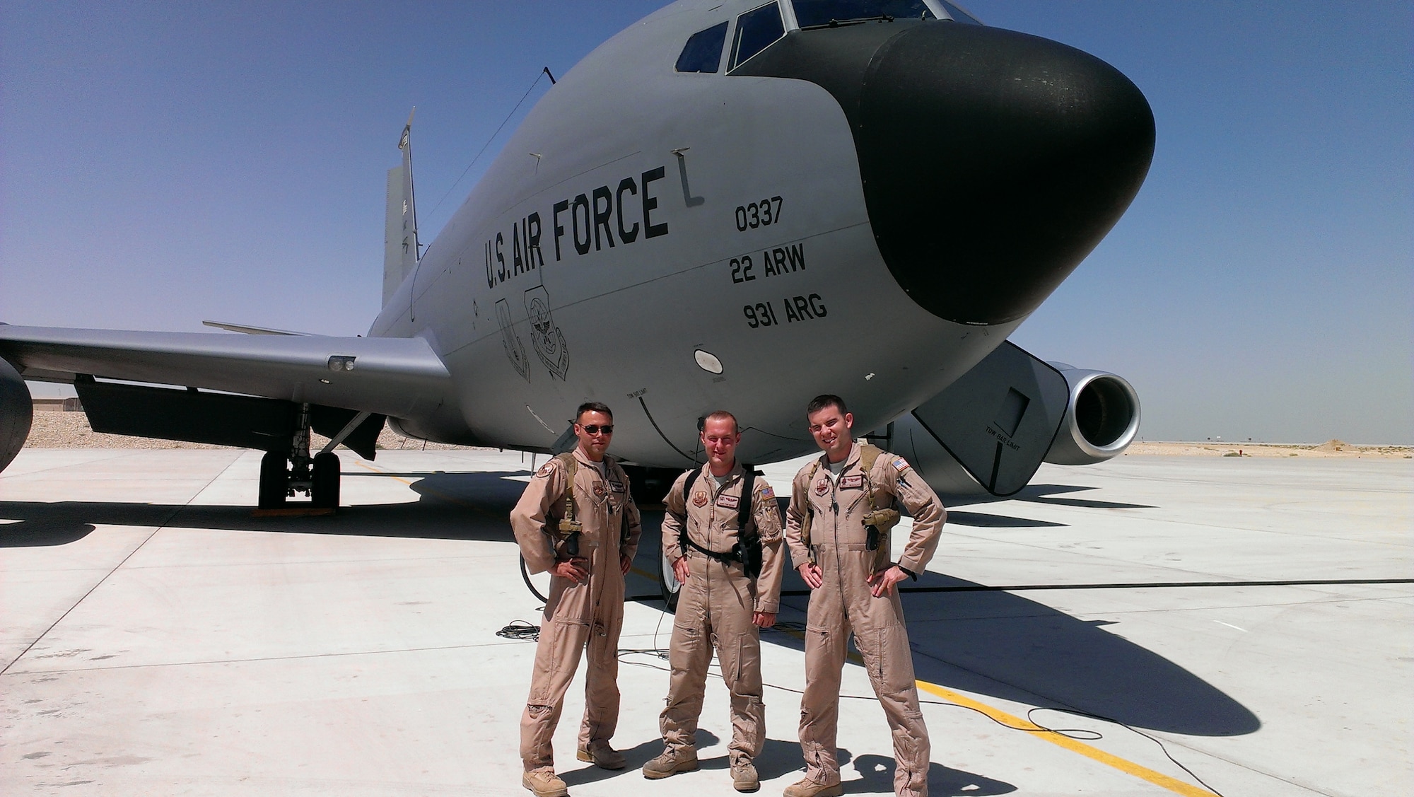 Maj. Robert Knapp, 22nd Air Refueling Wing executive officer, Capt. Brett McAuliff, 384th Air Refueling Squadron pilot, and Airman 1st Class Tim Neff, 350th ARS boom operator, stand in front of a KC-135 Stratotanker, July 25, 2013, at Manas, Kyrgyzstan. The Shell 72 crew won Air Mobility Command’s 2013 General James H. Doolittle Trophy for providing aerial refueling in support of Operation Enduring Freedom. (Courtesy photo)