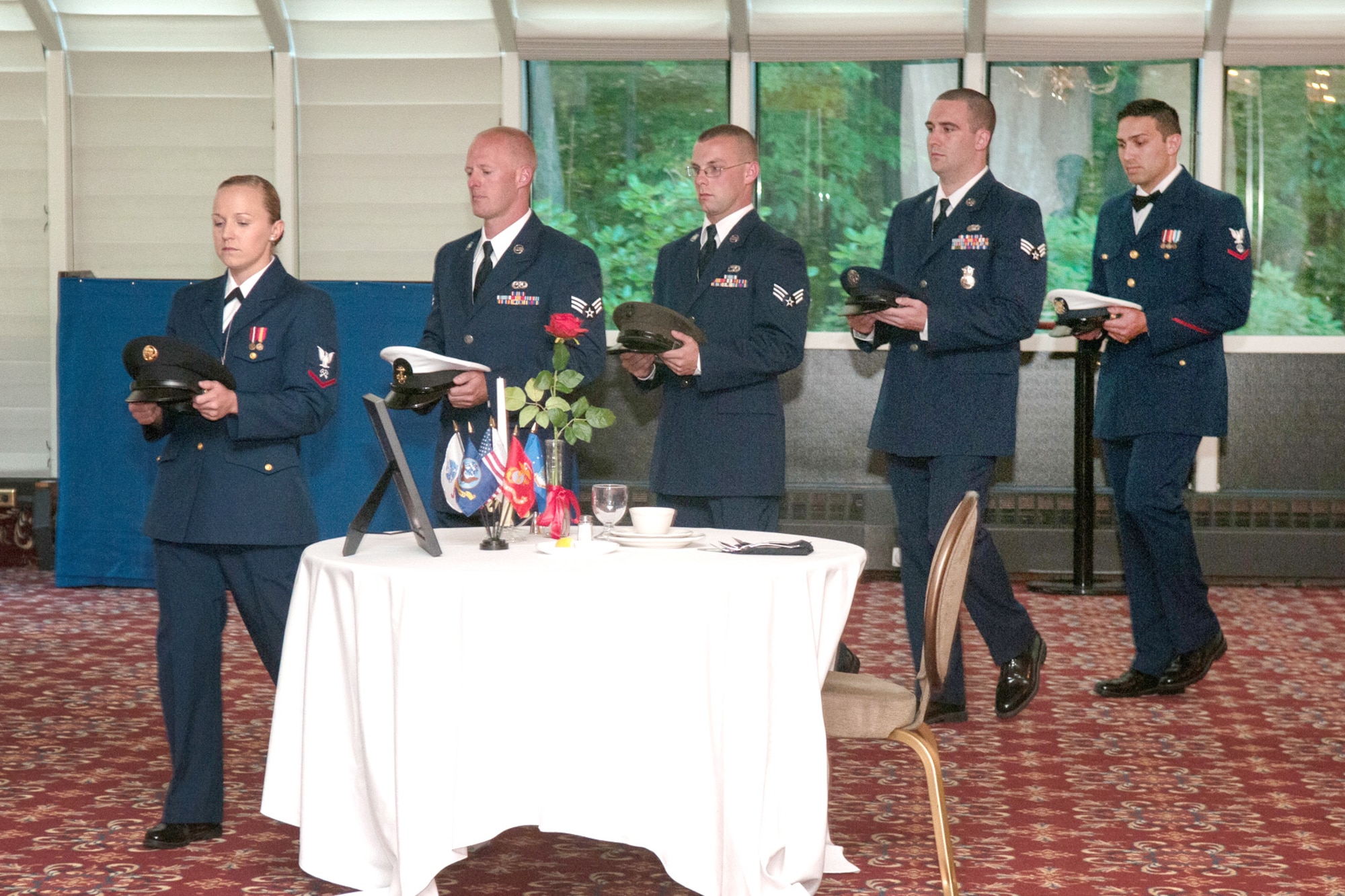 HANSCOM AIR FORCE BASE, Mass. – Graduating members of Airman Leadership School participate in a POW/MIA Remembrance ceremony as part of a class presentation during the ALS graduation ceremony at the Minuteman Commons July 11. ALS is a five week-long Air Force PME class designed to develop Airmen into effective front-line supervisors. The curriculum focuses on developing leadership abilities as well as effective communication. (U.S. Air Force photo by Mark Herlihy)