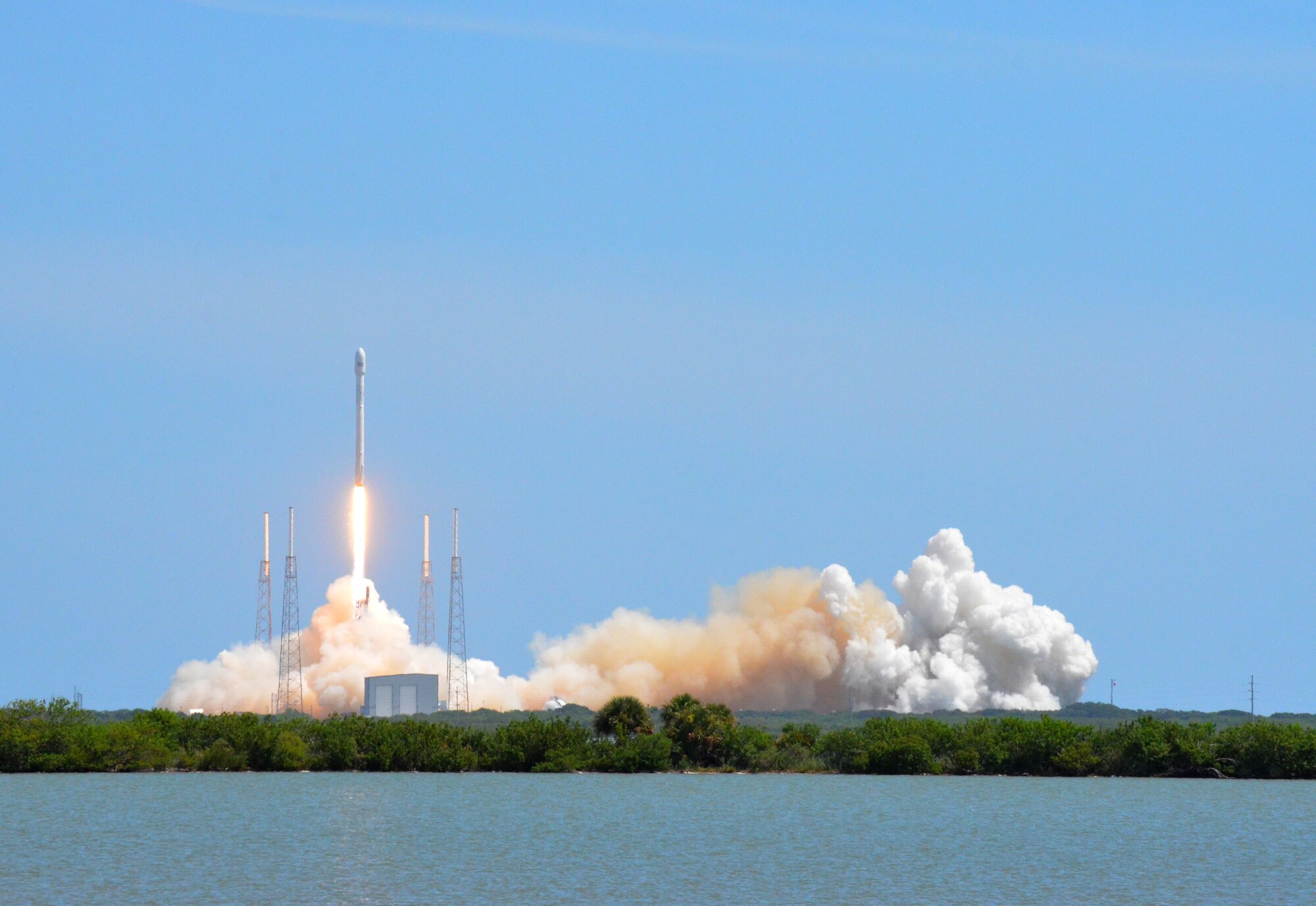 A Falcon 9 rocket launches from Cape Canaveral Air Station, Fla., July 14, 2014. The Falcon 9 is a two-stage rocket designed and manufactured by SpaceX for the reliable and safe transport of satellites and the Dragon spacecraft into orbit. (U.S. Air Force photo/Senior Airman Natasha Dowridge)