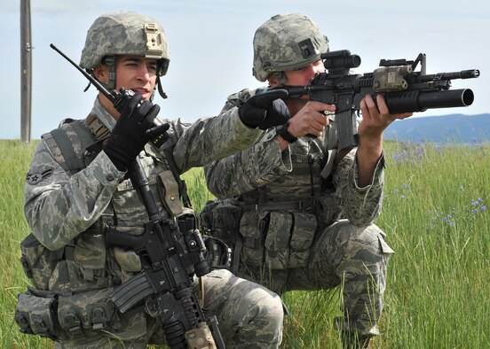 Airman 1st Class Trevor Hustad (left), and Airman 1st Class Ryan Walters, both 341st Missile Security Forces Squadron security team members, pose for a photo June 12 near Judith Gap, Mont. (U.S. Air Force photo/John Turner)