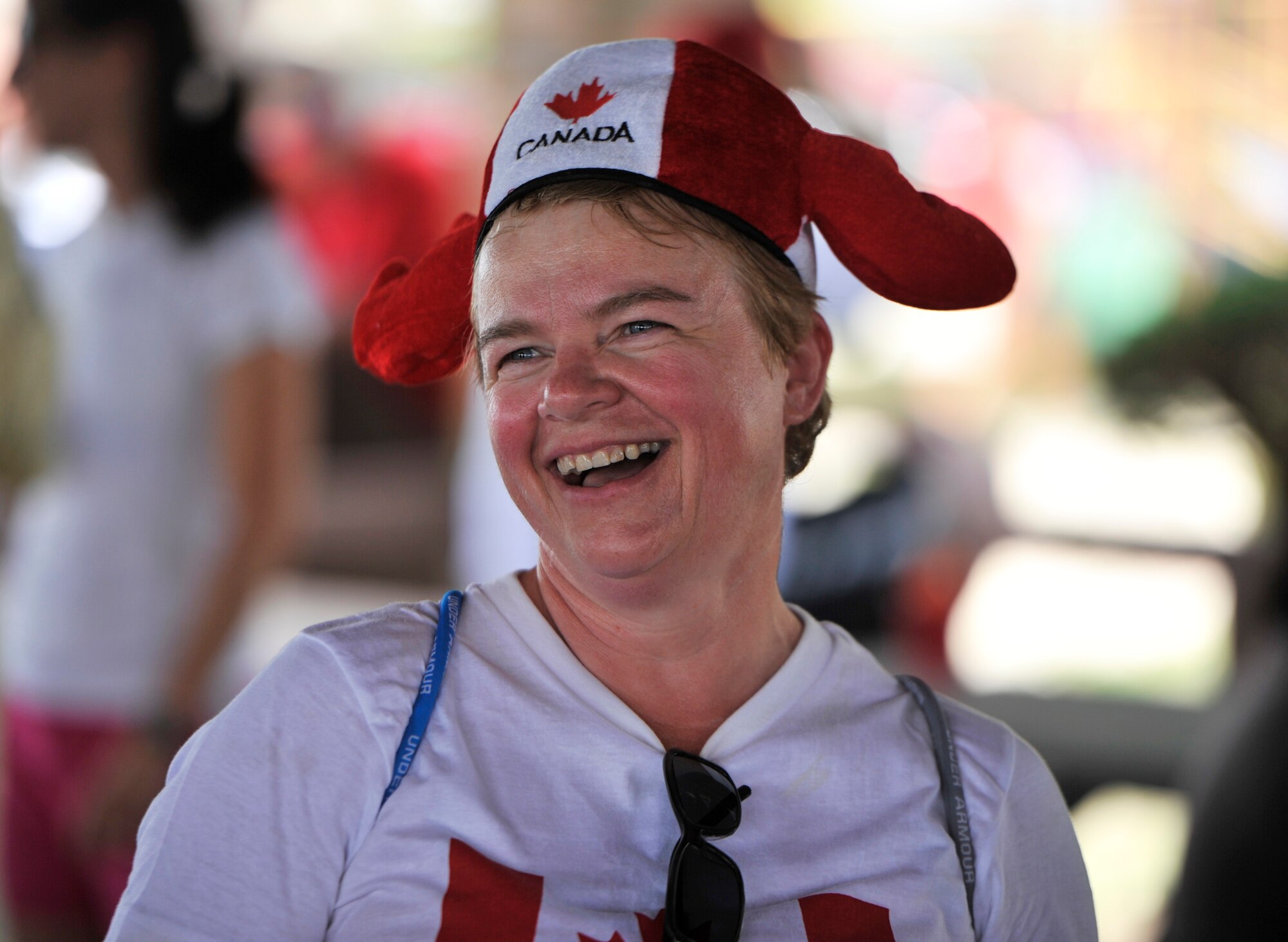 Solange Morin, wife of BGen Alain Pelletier, Deputy Commander, Continental U.S. Aerospace Defense Region, enjoys a laugh during Canada Day July 1 at Bonita Bay. This day marked the 147th celebration of the birth of Canda.