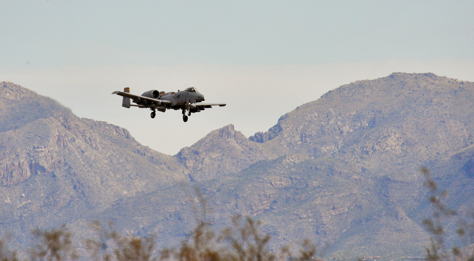 A U.S. Air Force A-10 Thunderbolt II flies towards the Barry M. Goldwater Range II for the 2014 Hawgsmoke Competition at Davis-Monthan Air Force Base, Ariz., July 10, 2014. The 355th Fighter Wing hosted 14 A-10 teams from around the world for the 8th biennial bombing, missile, and tactical gunnery competition known as Hawgsmoke July 9-12. (U.S. Air Force photo by Airman 1st Class Christopher Massey/Released)