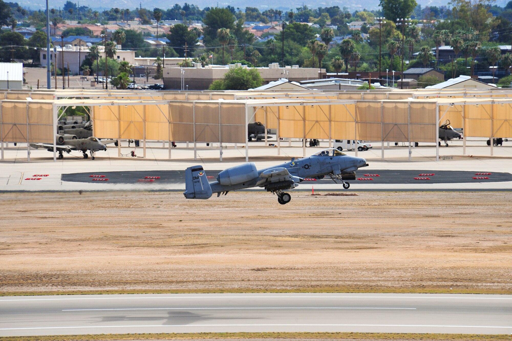 A U.S. Air Force A-10 Thunderbolt II takes off during the 2014 Hawgsmoke Competition at Davis-Monthan Air Force Base, Ariz., July 10, 2014. The competition focused on A-10 tactics such as high, medium and low-angle strafe techniques. (U.S. Air Force photo by Airman 1st Class Christopher Massey/Released)