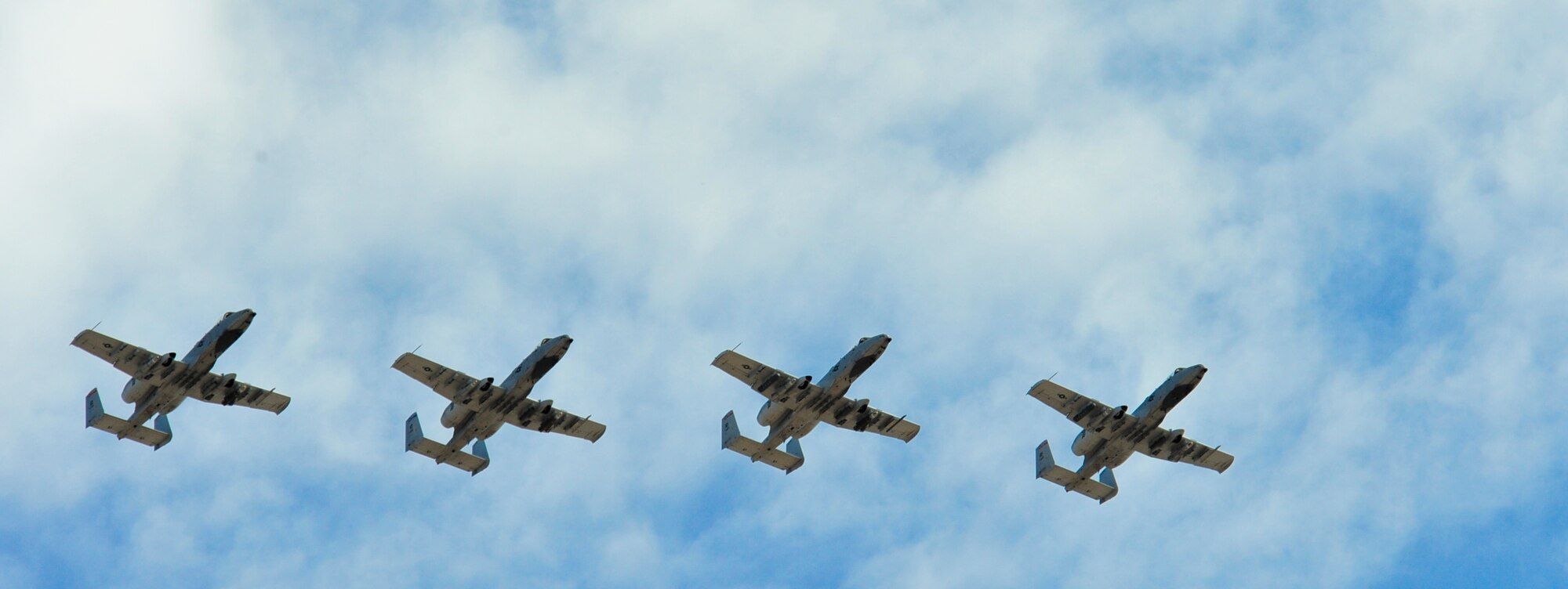 U.S. Air Force A-10 Thunderbolt II’s fly over during the beginning of the 2014 Hawgsmoke Competition at Davis-Monthan Air Force Base, Ariz., July 10, 2014. Hawgsmoke developed from the discontinued "Gunsmoke", which was an Air Force Worldwide Gunnery Competition. (U.S. Air Force photo by Airman 1st Class Christopher Massey/Released)