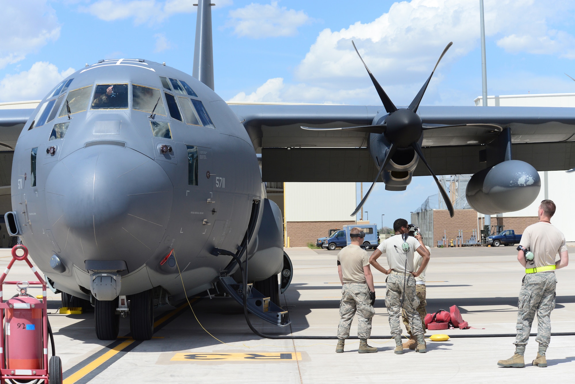 U.S. Air Force MC-130J Commando II maintainers gather to welcome the aircraft and its crew home from a nearly four-week mission around the world July 9, 2014 at Cannon Air Force Base, N.M. The mission was the first of its kind for Air Force Special Operations’ newest aircraft. 