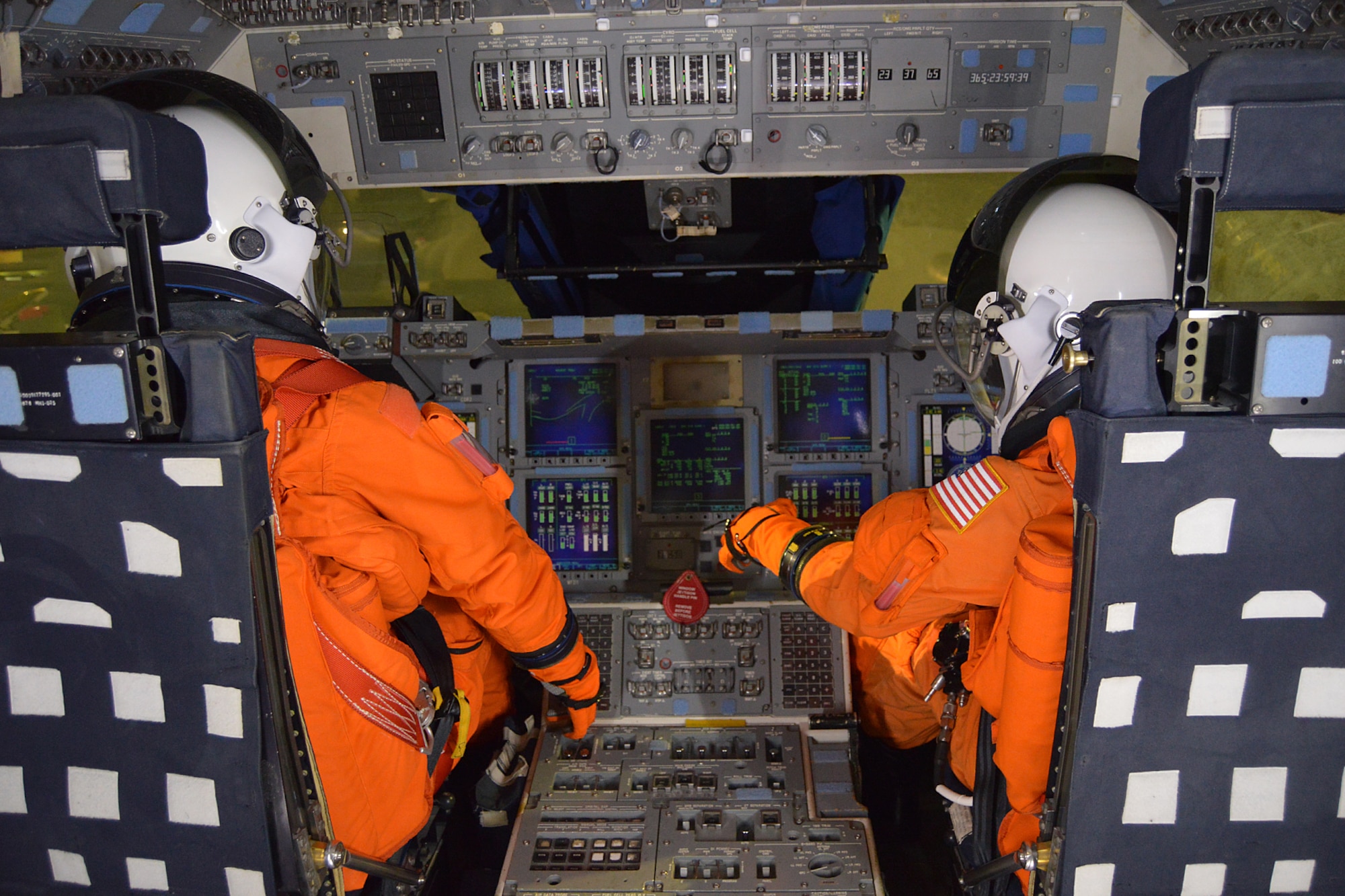 DAYTON, Ohio, --  Mannequins sit in the commander and pilot seats of the NASA Crew Compartment Trainer. . These replica pressure suits represent what astronauts wore during launch & entry. (U.S. Air Force photo)