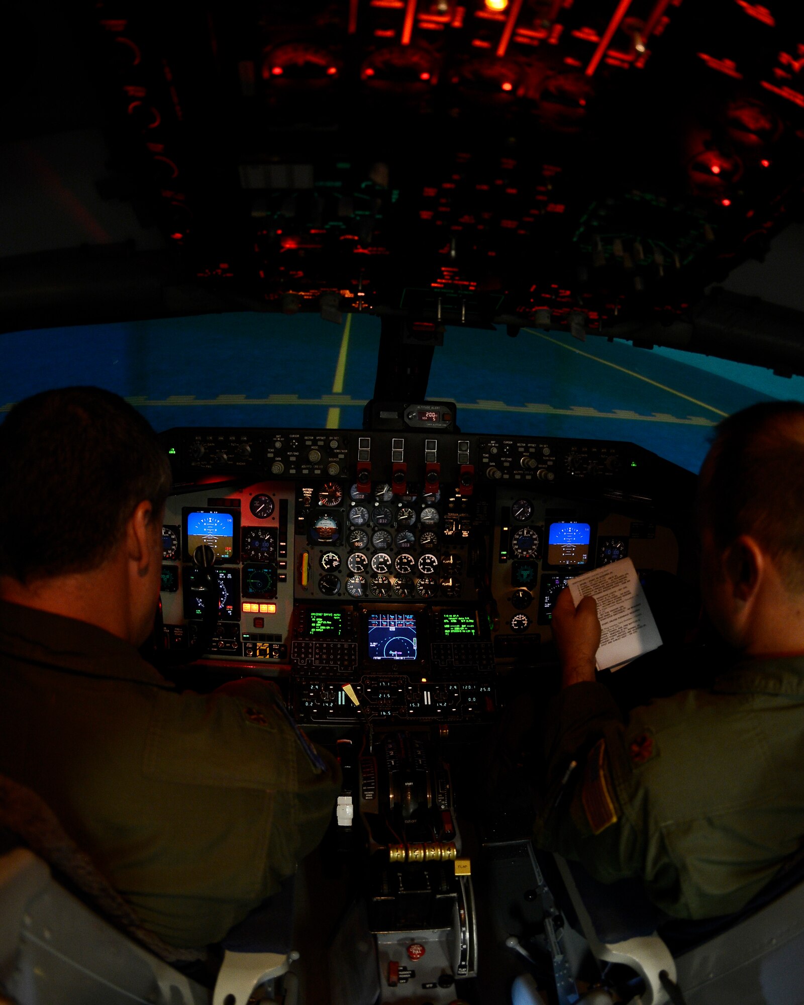 Maj. Mike Kirkner and Dean Rancourt, 63rd Air Refueling Squadron pilots, participate in a simulator training July 10, 2014 at MacDill Air Force Base, Fla. The reservists pilots are required to complete eight different simulation trainings a year. (U.S. Air Force photo by Senior Airman Jenay Randolph/Released) 