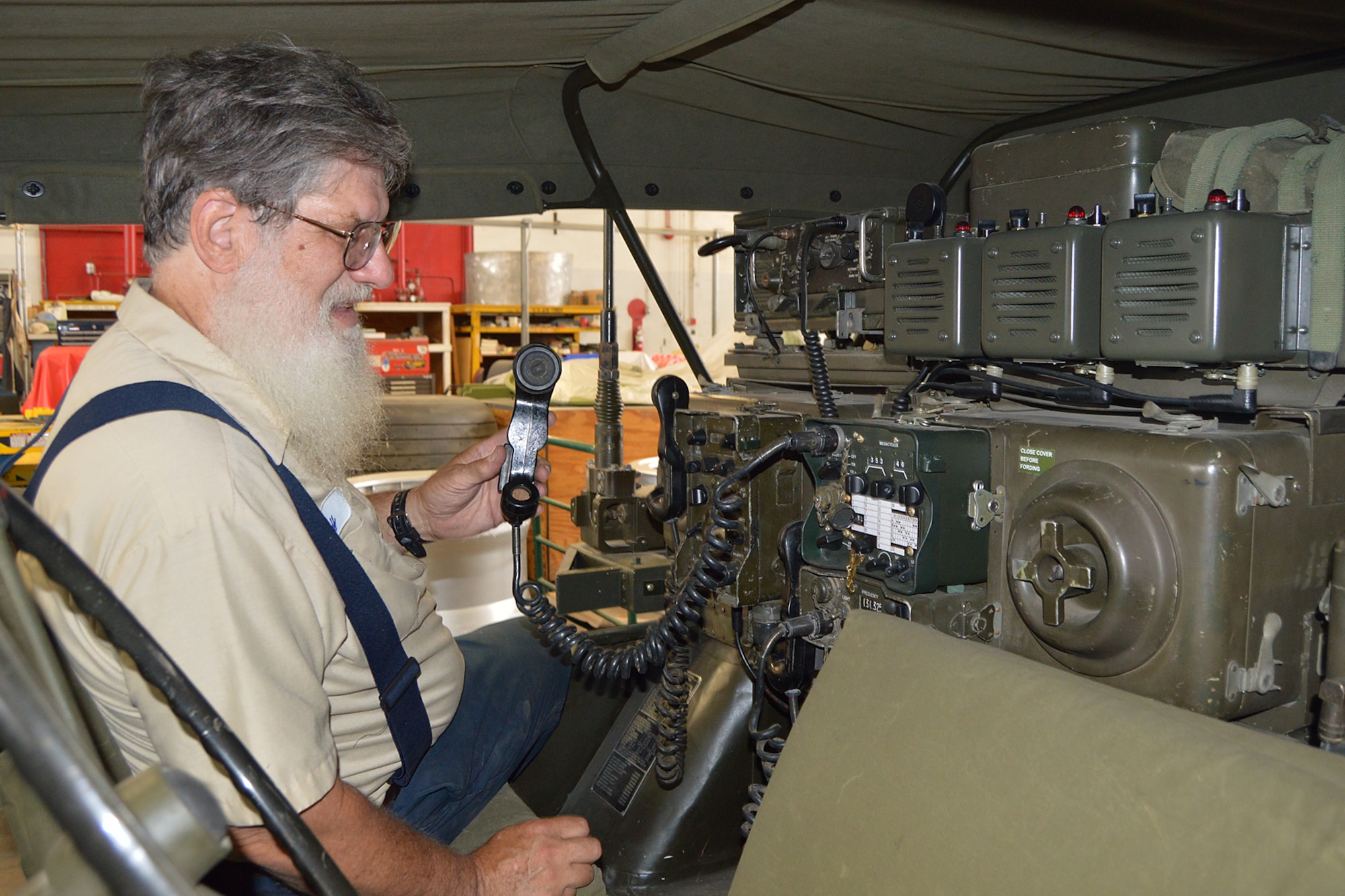 DAYTON, Ohio  -- Volunteer Larry Youngblood works on restoring the M151 Jeep. This vehicle was modified into a Forward Air Control (FAC) Jeep, which communicated with FAC aircraft to aid troops on the ground during the Southeast Asia War. Plans call for the Jeep to be displayed in the Southeast Asia War Gallery. (U.S. Air Force photo by Ken LaRock)