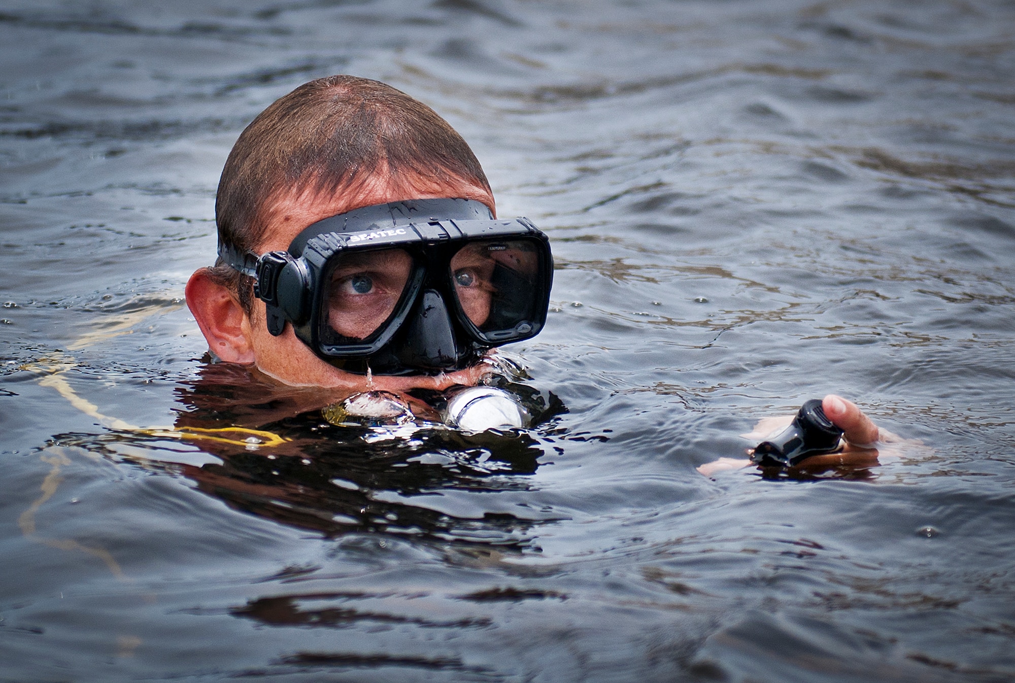 A Navy explosive ordnance disposal student surfaces from Weekly Bayou after a diving exercise at Eglin Air Force Base, Fla.  After completing the standard training course at Navy EOD school, Sailors attend the 55-day dive training on Eglin.  The Naval School EOD staff trains approximately 1,800 DOD military, civilian and international students annually.  (U.S. Air Force photo/Tech. Sgt. Samuel King Jr.)