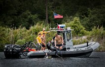 A Navy explosive ordnance disposal student climbs into a boat after a diving exercise in at Eglin Air Force Base, Fla.  After completing the standard training course at Navy EOD school, Sailors attend the 55-day dive training on Eglin.  The Naval School EOD staff trains approximately 1,800 DOD military, civilian and international students annually.  (U.S. Air Force photo/Tech. Sgt. Samuel King Jr.)