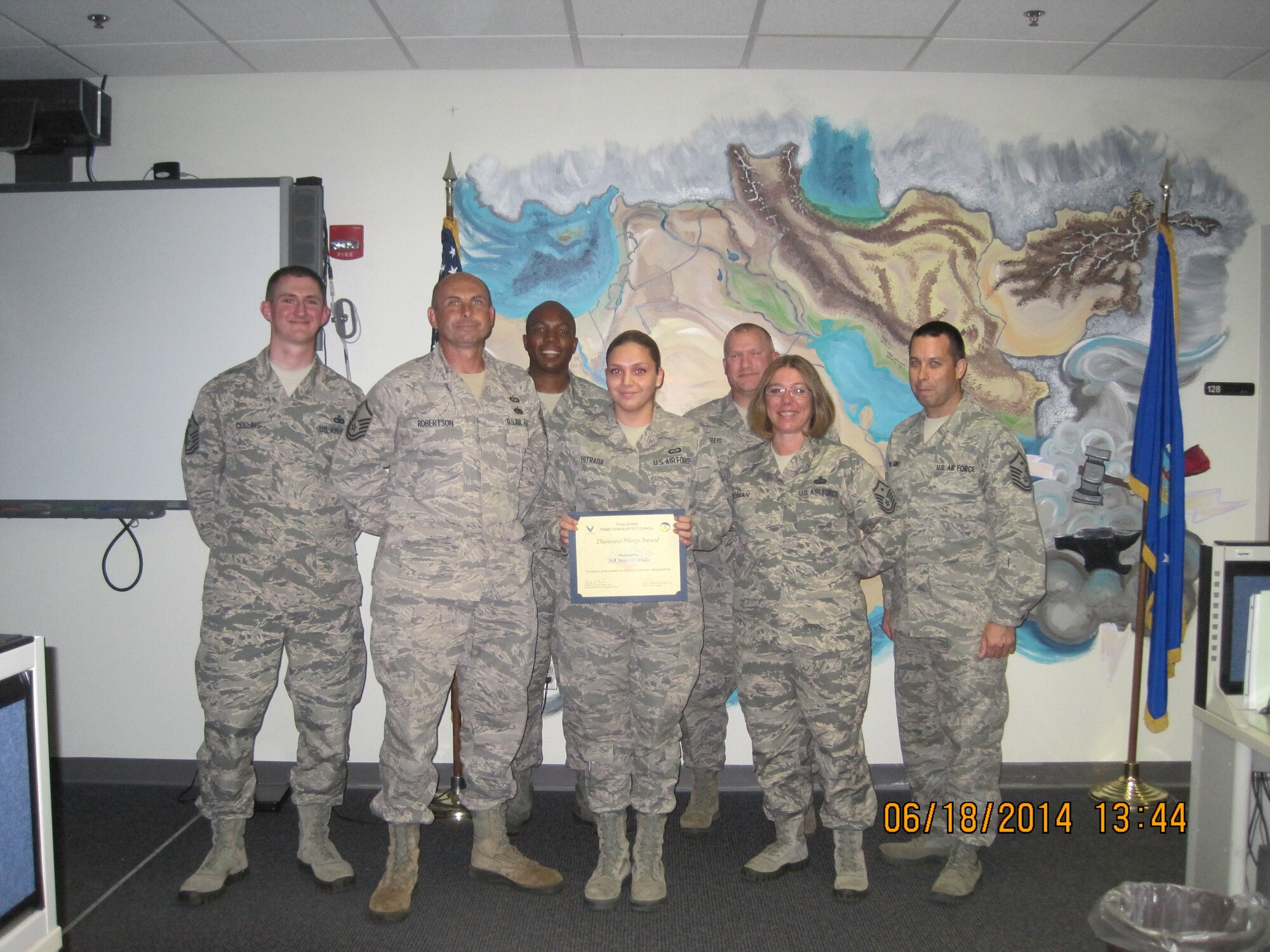 U.S. Air Force Senior Airman Jessica Estrada, 28th Operational Weather Squadron weather forecaster, is recognized by members of the Shaw First Sergeants Council as “Diamond Sharp.” Diamond Sharp, the First Sergeants Council’s newly adopted program, aims to recognize two Airmen from across Shaw Air Force Base monthly. (Courtesy photo)