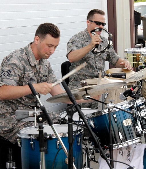 Percussionists with High Altitude, the rock band component of the Air National Guard Band of the Northeast, Tech Sgt. Adam Benham, left, and Senior Airman Simon Thomsen perform at Cassell Vineyards of Hershey, Hummelstown, Pennsylvania, June 27, 2014, as part of their annual summer tour. The Air National Guard Band of the Northeast is based out of Ft. Indiantown Gap, Pennsylvania and part of the 193rd Special Operations Wing. (U.S. Air National Guard photo by Tech. Sgt. Culeen Shaffer/Released)