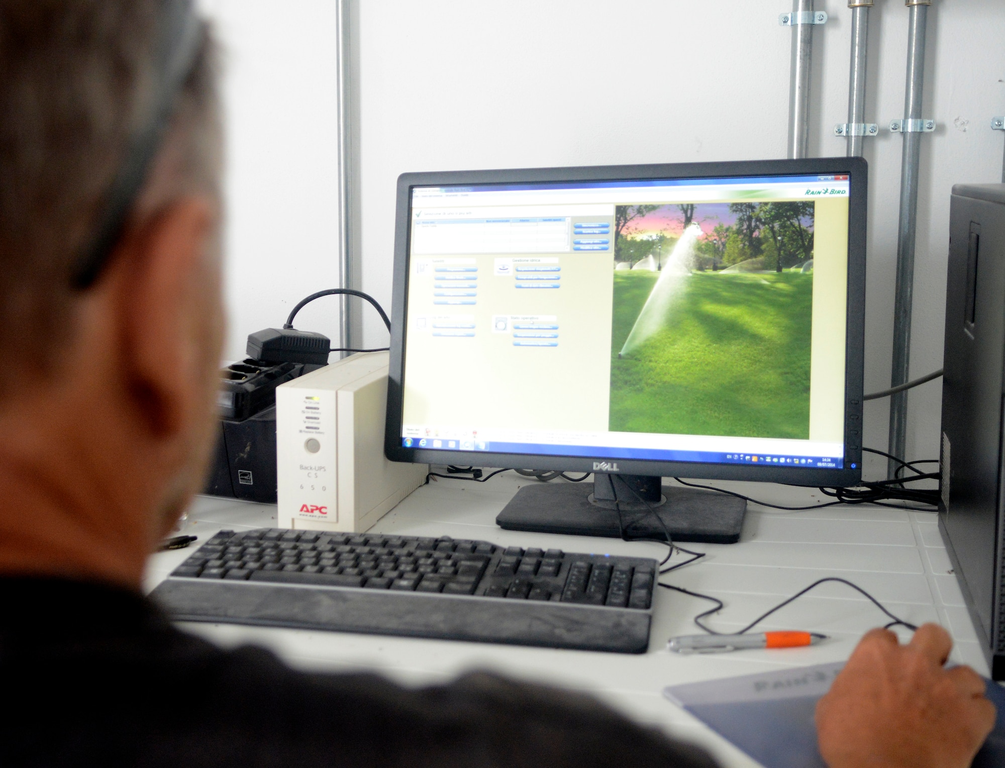 Neville Besignach, 31st Force Support Squadron varsity sports director, uses a computer program to communicate with a control station that manages the watering schedule of two fields within the Area F sports complex. The sports complex is watered with agricultural water, which saves the base $40,000 a year. (U.S. Air Force photo/Staff Sgt. R.J. Biermann)