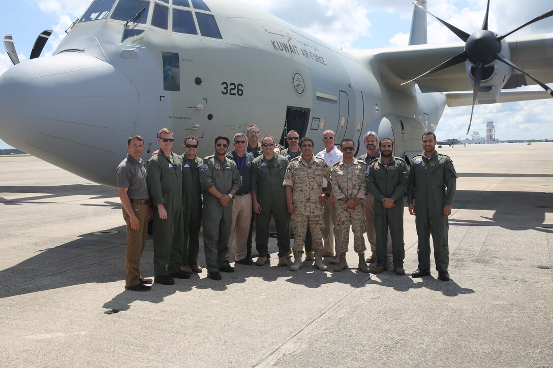 Members of the Kuwait Air Force and Aviation Training Consulting pose near the first Kuwait Air Force KC-130J Hercules that landed at Marine Corps Air Station Cherry Point, N.C., July 1, 2014. The aircraft arriving here marks a significant training milestone in U.S. – Kuwait military relations. Two additional Kuwaiti KC-130Js are scheduled to arrive at the air station in the upcoming weeks for a safety inspection and to be retrofitted with safety equipment before all three aircraft return to Kuwait. ATC is training Kuwait Air Force pilots, load masters and crew chiefs to operate the KC-130J Hercules to Marine Corps standards.