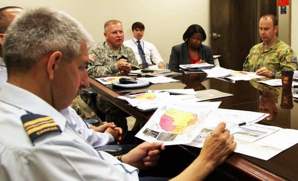 Col. Robert Ruch, Huntsville Center commander, center, and Janet Phillips, HQ U.S. Army Corps of Engineers, Deputy Chief of Security Assistance, provided a capabilities brief to foreign military officers associated with the Army Program Executive Office-Aviation July 10. 