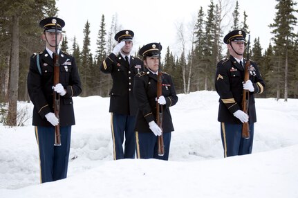 Members of the Alaska National Guard Military Funeral Honors Team stand ready during funeral services at Fort Richardson National Cemetery Dec. 20, 2011. The Military Funeral Honors Team provides military honors for Alaska's 77,000 veterans.