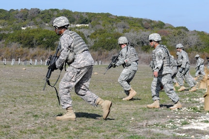 Soldiers in the 120th Infantry Brigade's 2nd Battalion, 393rd Infantry Regiment move toward their targets during a short-range marksmanship range at Fort Hood, Texas, Feb 7, 2012. The unit's primary mission is planning and resourcing culminating training events for Army National Guard and Reserve units deploying overseas. In between training units, "Dakota" battalion Soldiers maintain their basic infantryman skills.