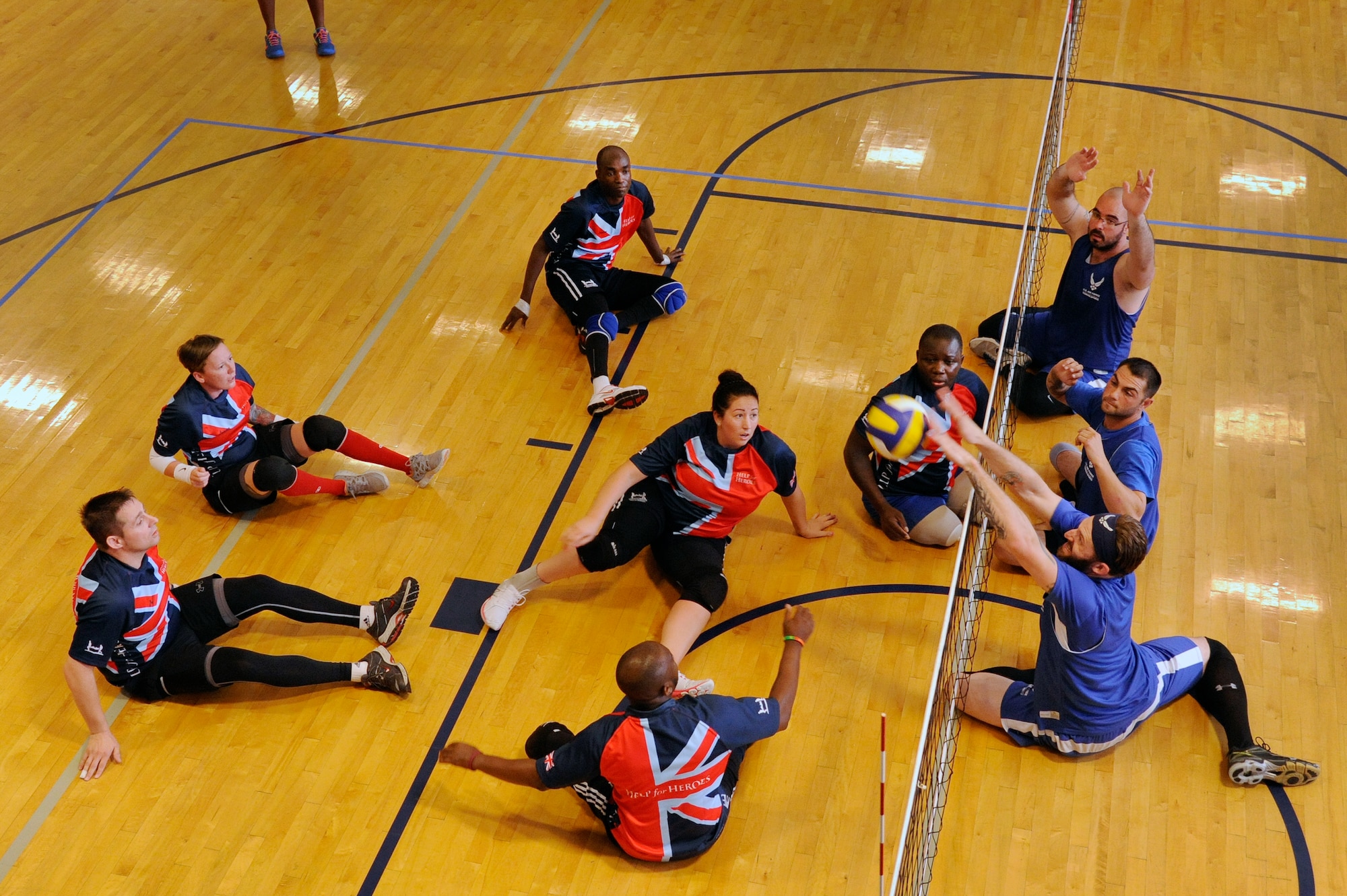 The Air Force team scrimmages the United Kingdom team July 9, 2014, during the 2014 Wounded Warrior Summer Invitational Adaptive Sports Tournament at the Rambler Fitness Center at Joint Base San Antonio-Randolph, Texas. The event features 100 wounded warriors from both the U.S. and the United Kingdom. The event is leading up to two other events beginning this September, which are the Warrior Games being held in Colorado Springs, Colorado, and the Invictus Games being held in the U.K. (U.S. Air Force photo/Desiree N. Palacios)