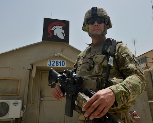 Staff Sgt. Jesus Yanez stands in front of his sector station July 2, 2014, on Bagram Airfield, Afghanistan. Yanez has served in four military branches throughout his career. He is a 455th Expeditionary Base Defense Squadron defender and a native of El Paso, Texas. (U.S. Air Force photo/Staff Sgt. Evelyn Chavez)