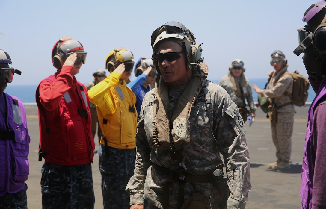 U.S. 5TH FLEET AREA OF RESPONSIBILITY (July 12, 2014) U.S. Army Lt. Gen. James Terry, U.S. Army Central commanding general, arrives to visit Marines and Sailors aboard the multi-purpose amphibious assault ship USS Bataan (LHD 5). The 22nd MEU is deployed with the Bataan Amphibious Ready Group as a theater reserve and crisis response force throughout U.S. Central Command and the U.S. 5th Fleet area of responsibility. (U.S. Marine Corps photo by Cpl. Caleb McDonald/Released)