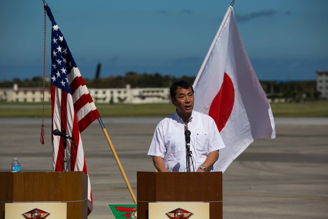 Toshihisa Takata addresses an audience July 15 on Marine Corps Air Station Futenma during Marine Aerial Refueler Transport Squadron 152’s take off ceremony. “I’d like to express my gratitude for your continuous engagement with strengthening the Japan-U.S. alliance as well as all your constructive efforts and initiatives to further the relationships with your host communities,” said Takata. Takata is the ambassador in charge of Okinawan Affairs, Ministry of Foreign Affairs of Japan. VMGR-152 is with Marine Aircraft Group 36, 1st Marine Aircraft Wing, III Marine Expeditionary Force. (U.S. Marine Corps photo by Cpl. Natalie M. Rostran/Released)