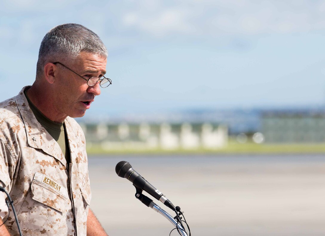 Brig. Gen. Paul J. Kennedy addresses an audience July 15 on Marine Corps Air Station Futenma during Marine Aerial Refueler Transport Squadron 152’s take off ceremony. The ceremony commemorates the beginning of VMGR-152’s transfer to MCAS Iwakuni as part of the Marine Corps and Government of Japan’s bilateral effort to reduce impact to communities around MCAS Futenma, realign the presence and distribute the activities of U.S. forces in Japan. Kennedy is the deputy commanding general of III MEF and commanding general of 3rd Marine Expeditionary Brigade. VMGR-152 is with Marine Aircraft Group 36, 1st Marine Aircraft Wing, III MEF. 