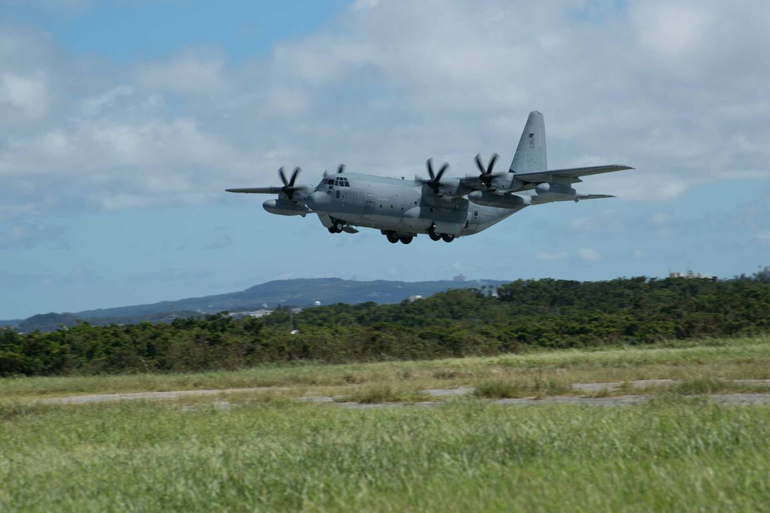 A KC-130J Super Hercules takes to the sky July 15 from Marine Corps Air Station Futenma during Marine Aerial Refueler Transport Squadron 152’s take off ceremony. The aircraft is the first to make the official flight to their new hangar on MCAS Iwakuni. VMGR-152 is with Marine Aircraft Group 36, 1st Marine Aircraft Wing, III Marine Expeditionary Force. (U.S. Marine Corps photo by Lance Cpl. Pete Sanders/Released)