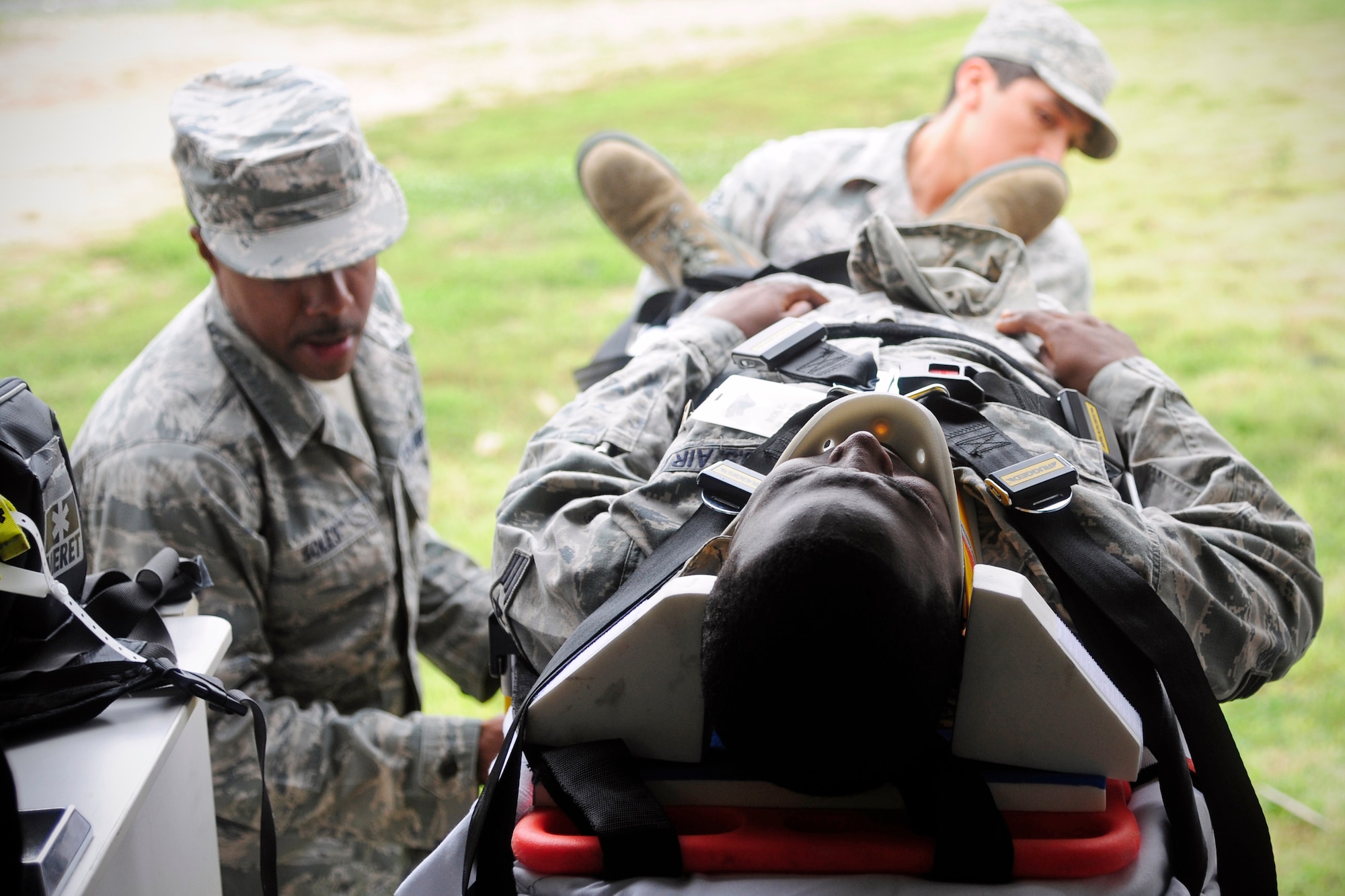 Emergency responders lift a simulated victim into an ambulance during exercise Beverly Midnight 14-2 at Kunsan Air Base, Republic of Korea, July 15, 2014. . The Operational Readiness Exercise assesses mission capabilities and ensures the Wolf Pack is in a constant state of readiness.  (U.S. Air Force photo by Senior Airman Taylor Curry/Released) 