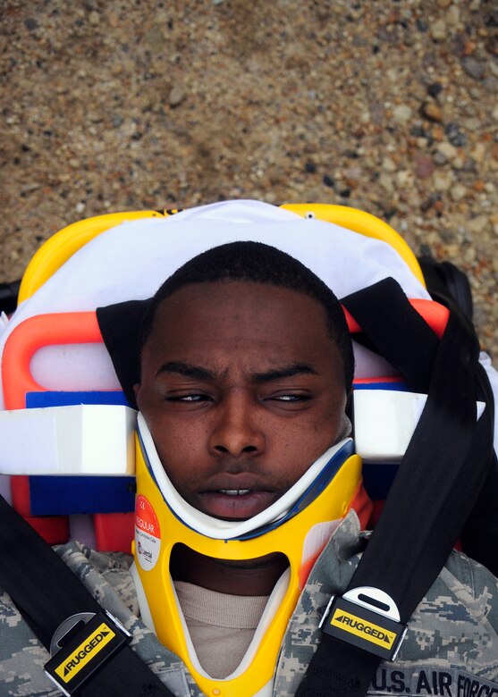 Senior Airman Anthony Costello, 8th Logistics Readiness Squadron, simulates being a victim of a vehicular accident during exercise Beverly Midnight 14-2 at Kunsan Air Base, Republic of Korea, July 15, 2014. . The Operational Readiness Exercise assesses mission capabilities and ensures the Wolf Pack is in a constant state of readiness. (U.S. Air Force photo by Senior Airman Taylor Curry/Released) 