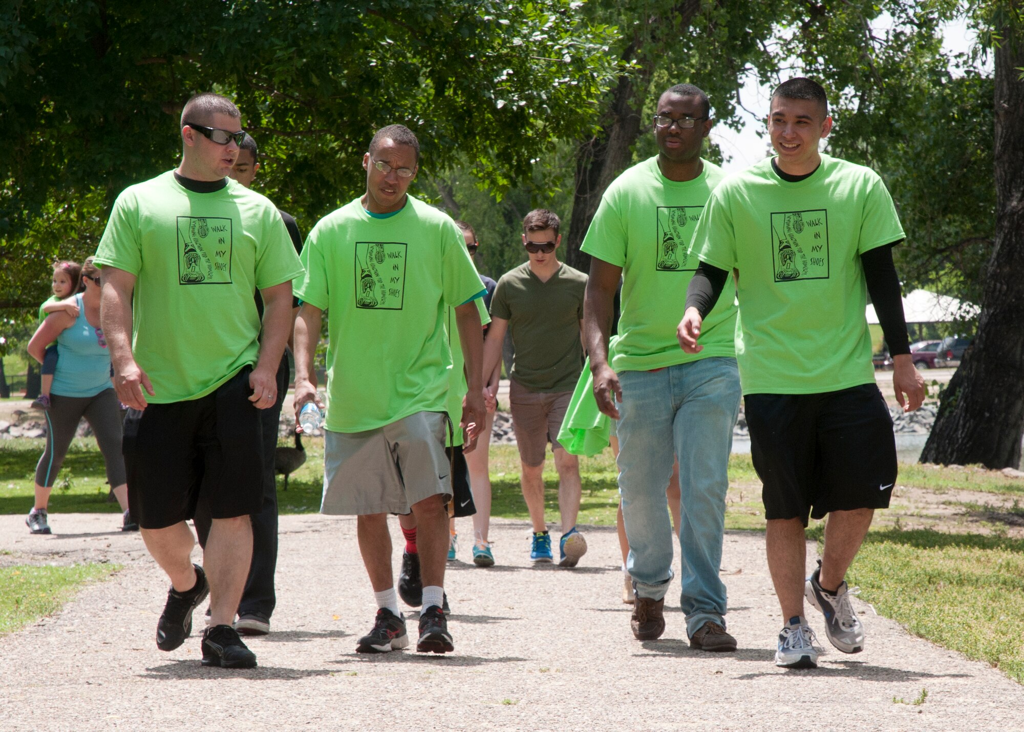 Service members, from F.E. Warren Air Force Base, volunteer their time July 12, 2014, during the Walk in my Shoes fundraiser. This year’s Walk in my Shoes event had 60 more donators thanks to the support of F.E. Warren Airmen compared to the previous year’s 10. The money raised goes to the Wyoming Coalition for the Homeless to help support those in need.